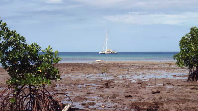 Jangada, anchored off the island of Pana Wina in the big Tagula lagoon, in the Louisiades 