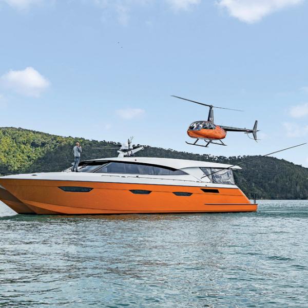 For Wayne Valder, there’s no better way to get aboard than by helicopter! Note that the idea for orange hulls was borrowed from Bentley.