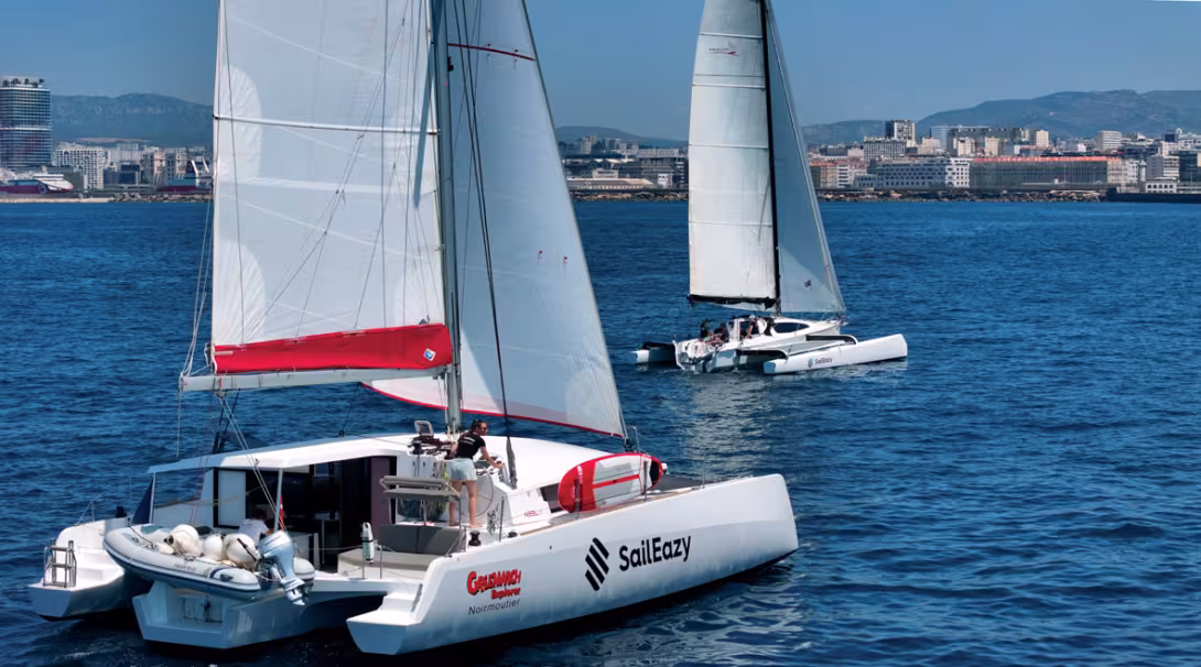 The Neel 43 and Tricat 30 side by side in Marseille harbor.  A Dragonfly will be joining the fleet in 2025.