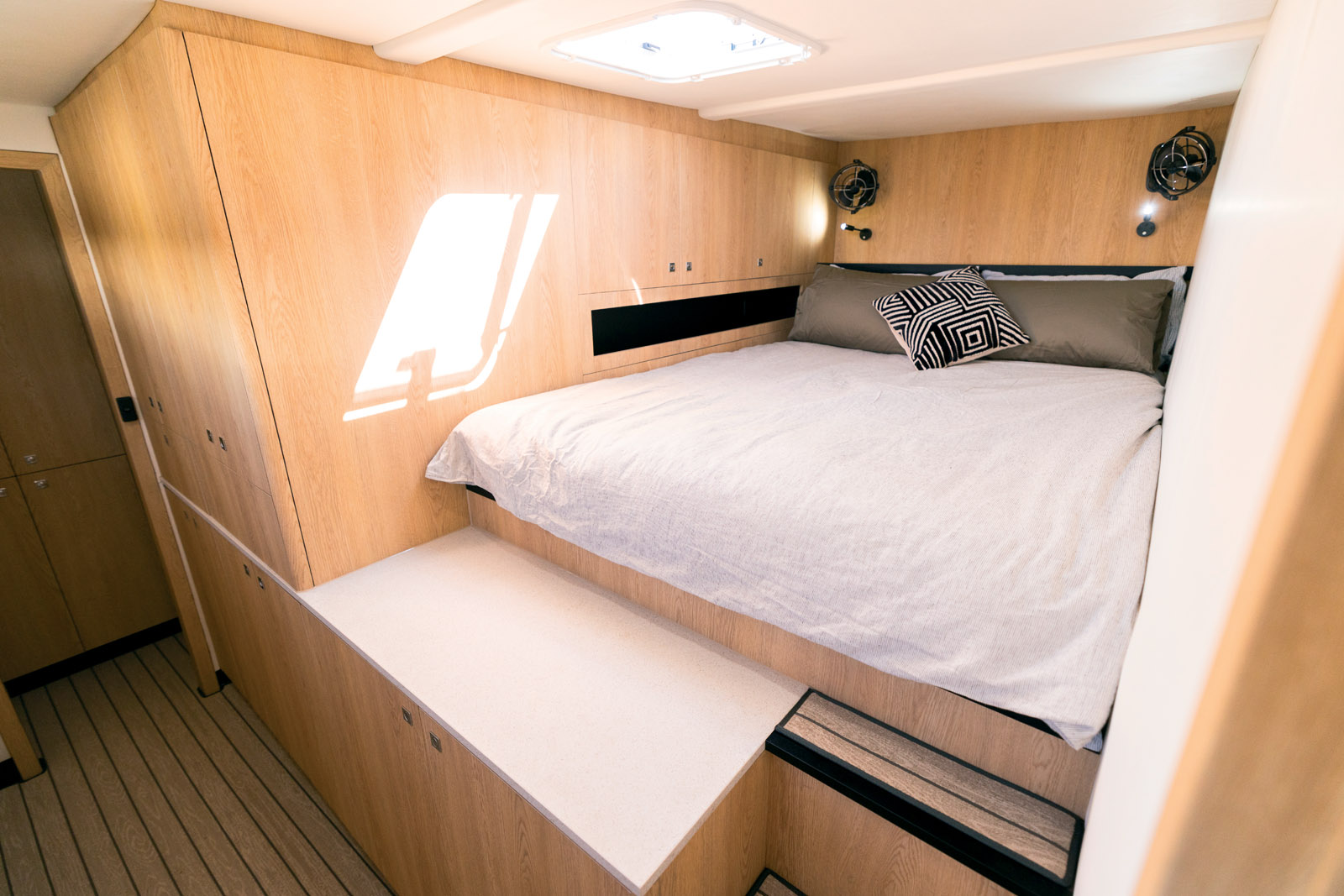 The guest cabin on the forward port has a queen-sized bed with ample headroom. Note all the cabinetry.