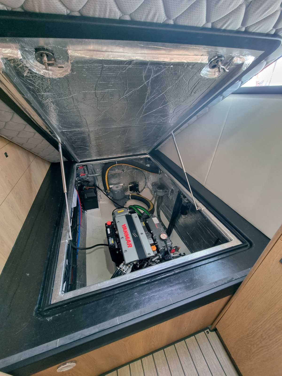 To compensate for the weight of the engines under the aft bunks, the batteries add weight forward.