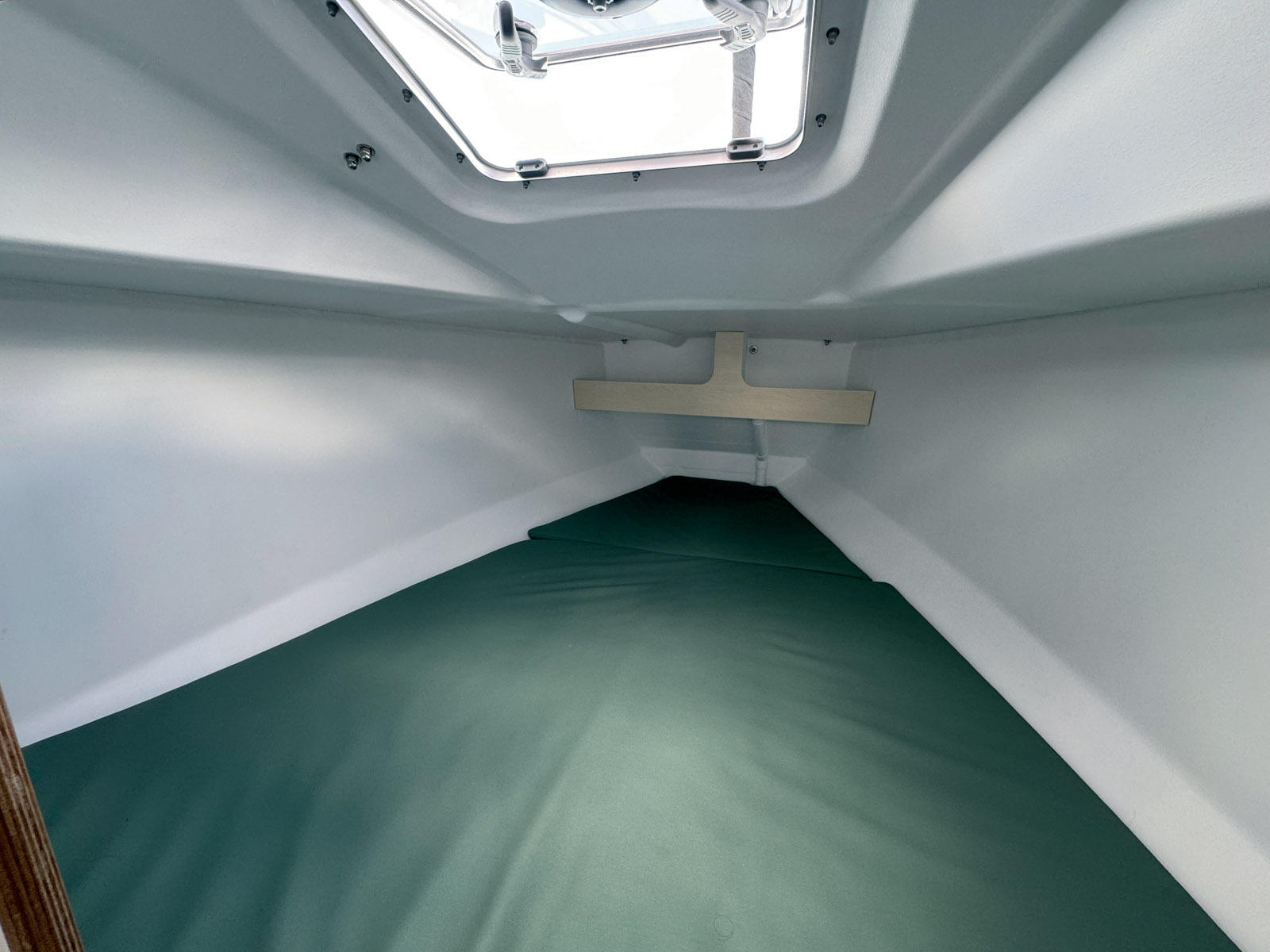 The forward berth has a slatted bed base.
