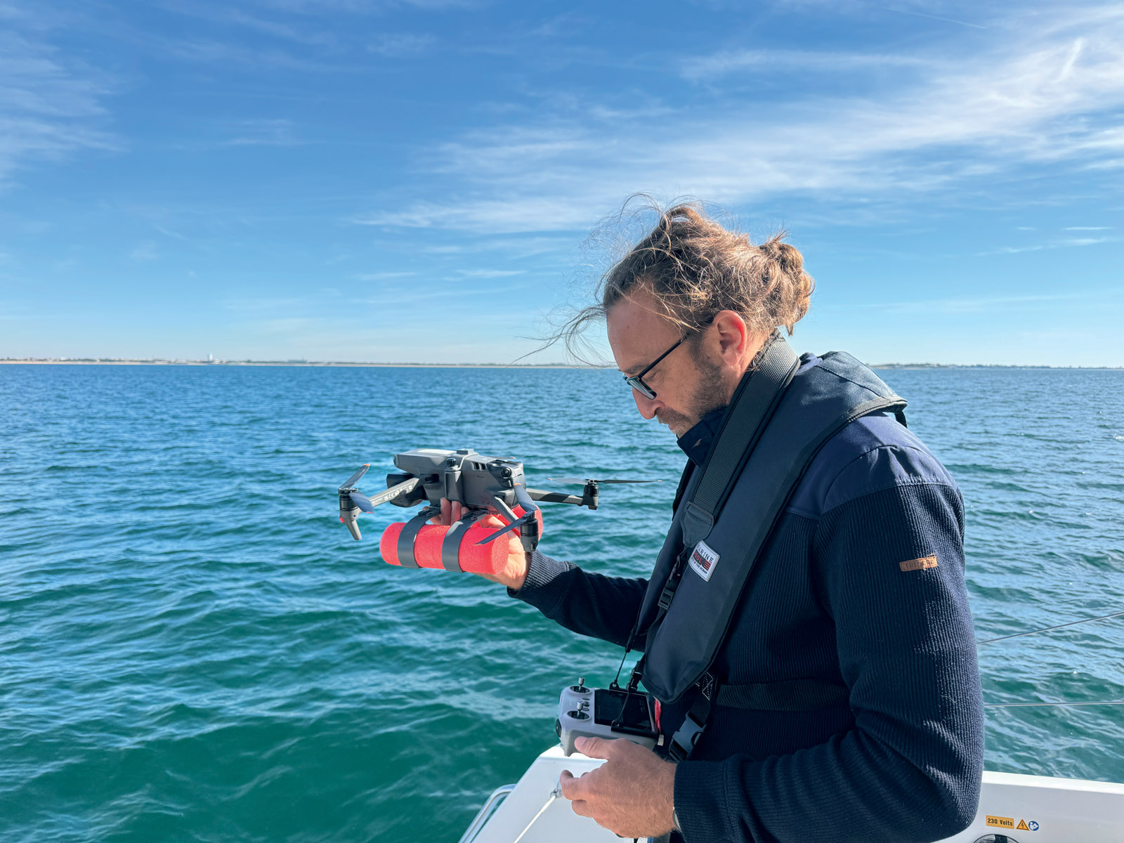The floats allow the drone to ‘land’ in an emergency...  but its aerodynamic qualities are significantly affected.
